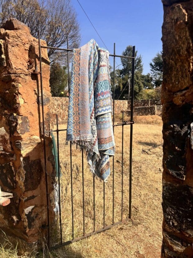 Handcrafted Karoo crochet blanket in vibrant colors.