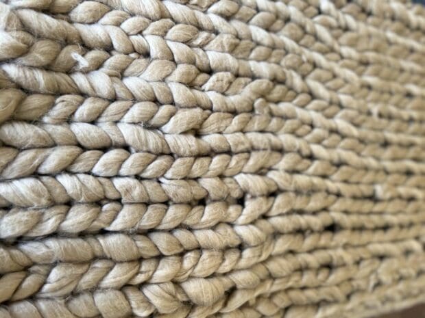 Natural-colored chunky knit throw for your bed